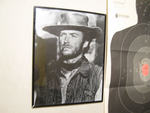 2000 Mercury Grand Marquis - A framed portrait of Clint Eastwood, possibly from a Western film, hangs next to a shooting target.