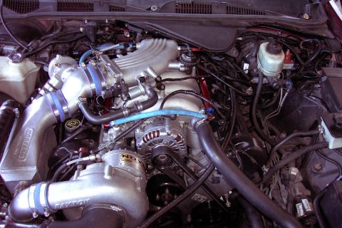1992 Ford Crown Victoria - Close-up of a modified engine, a supercharger and custom intake plumbing.