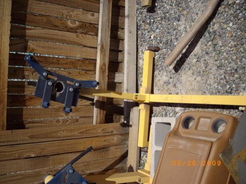 1982 Toyota 4Runner - Engine hoist parts and a dashboard piece are visible in this outdoor scene with a wooden wall.