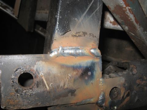 1978 Ford Bronco - This image shows a close-up view of welded metal frame components, with visible weld marks and signs of rust.