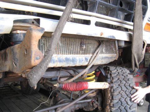 1978 Ford Bronco - Front suspension and radiator of a 1978 Ford Bronco, undergoing maintenance or repair.
