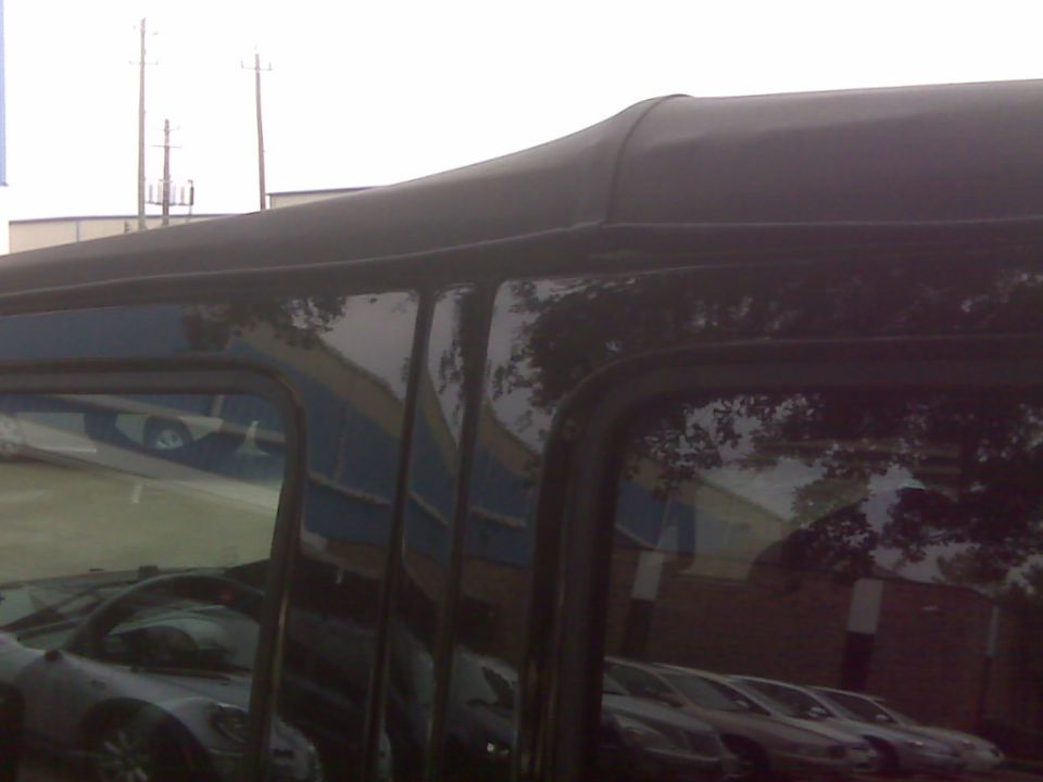 Black soft top detail on a vehicle side view