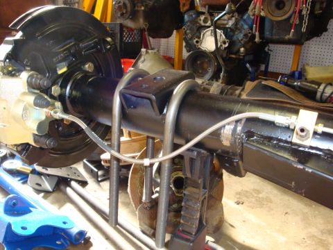 1989 Ford Bronco - Rear axle assembly with disc brakes and U-bolts, likely part of a suspension modification.