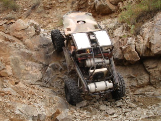 1966 Ford Bronco - This off-road vehicle navigates a steep, rocky incline.
