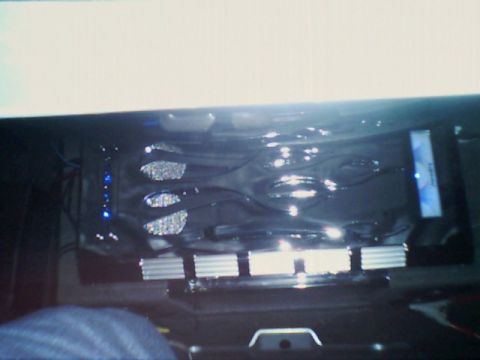 1998 Ford Taurus - Aftermarket audio equipment is installed in the car's interior, with visible blue LEDs and chrome details.