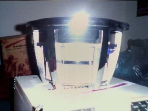 1998 Ford Taurus - A car subwoofer is shown, resting on a box. The registry claims it is a 1998 Ford Taurus, but this is incorrect.