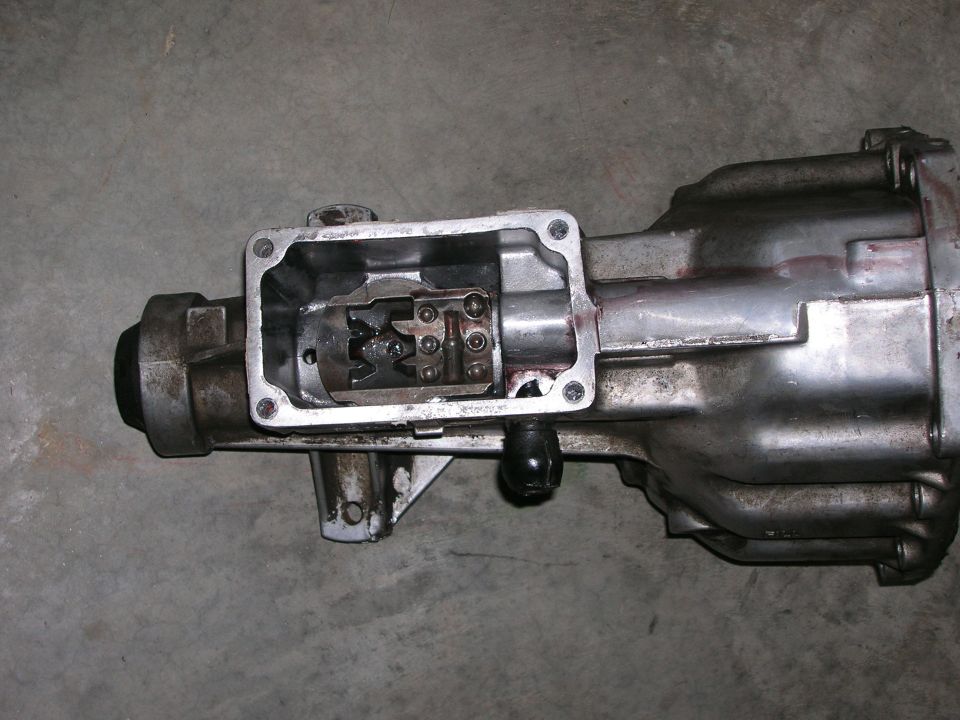 Manual transmission case with the shifter top cover removed showing shift forks