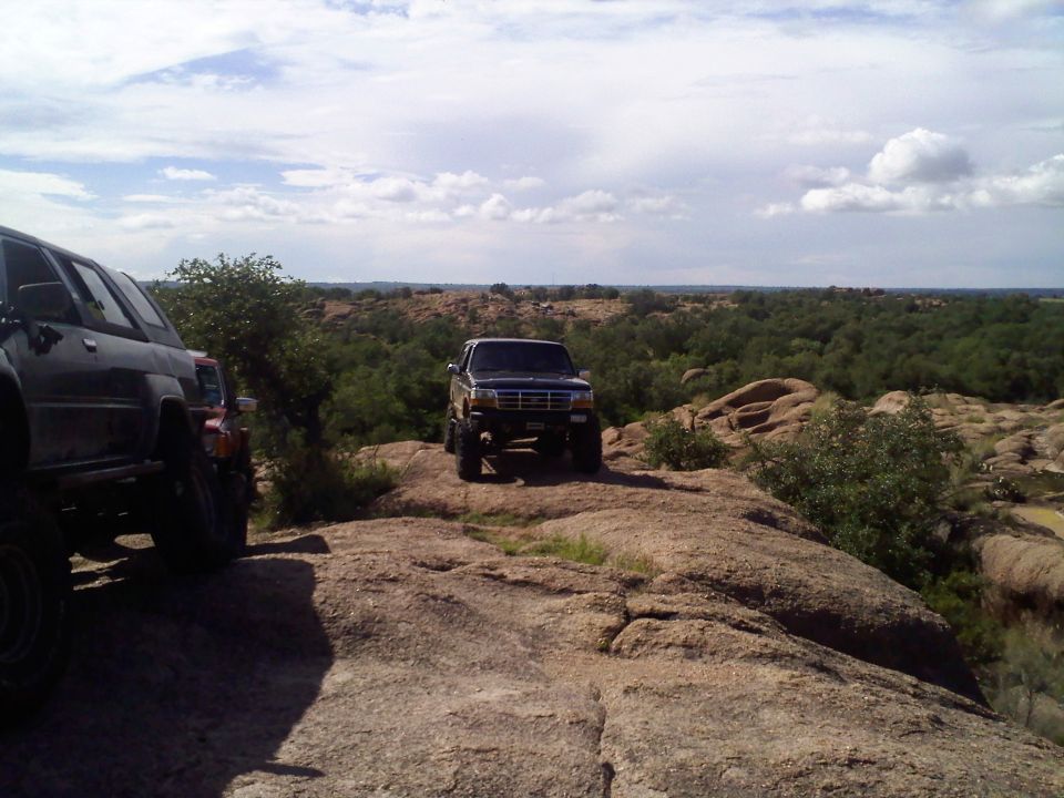 Ford Bronco parked on rocks with another SUV to the left