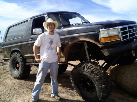 1995 Ford Bronco - Modified 1995 Ford Bronco with extreme suspension lift and oversized tires, ready for off-road adventures.