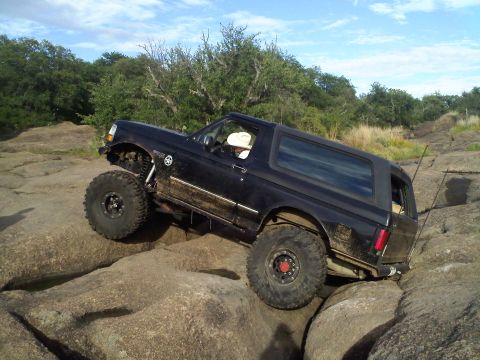 1995 Ford Bronco - This 1995 Ford Bronco navigates a challenging rocky terrain, its off-road capabilities.