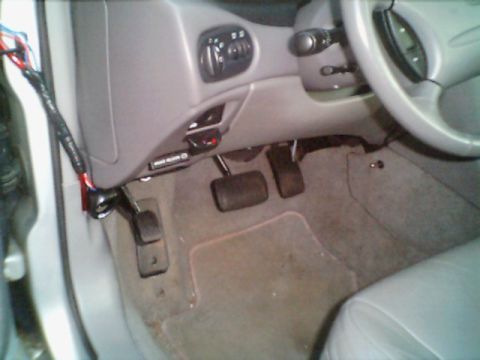1998 Ford Taurus - Interior view of a 1998 Ford Taurus, highlighting the driver's side footwell and dashboard.