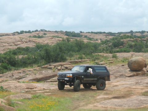 1995 Ford Bronco - Off-road adventure in a 1995 Ford Bronco through a , rocky terrain.