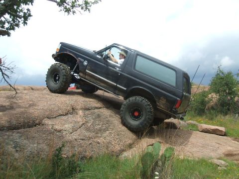 1995 Ford Bronco - This 1995 Ford Bronco is navigating a challenging rocky terrain.