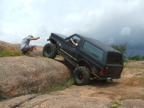 1995 Ford Bronco - This 1995 Ford Bronco is navigating a challenging rocky terrain off-road.