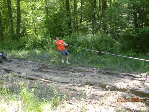 1998 Chevrolet Blazer - Man pulls rope in muddy forest scene with watermark "05/27/2009 SUPERMOTORS.NET".