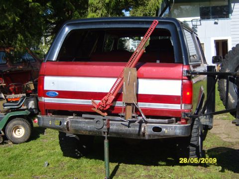 1989 Ford Bronco - Rear view of a 1989 Ford Bronco, equipped with a Hi-Lift jack and spare tire carrier.