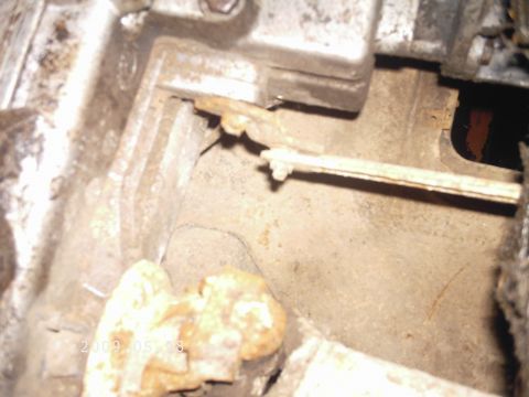 1986 Ford Bronco - A close-up view of a corroded mechanical part, possibly from a vehicle's drivetrain.