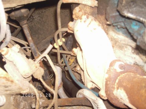 1986 Ford Bronco - Engine bay components including hoses and wiring are visible in this close-up shot.