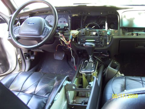 2003 Ford Crown Victoria - Interior view of a 2003 Ford Crown Victoria with the dashboard disassembled for repairs.