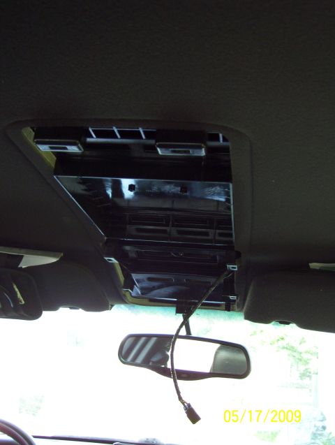 2003 Ford Crown Victoria - The overhead console has been removed, revealing the interior ceiling structure and wiring.