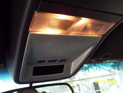 2003 Ford Crown Victoria - Interior view of a vehicle's overhead console, showing lights and control buttons.