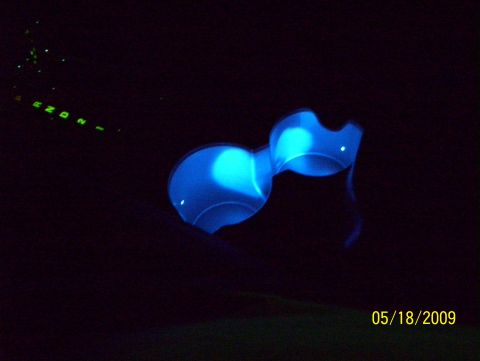 2003 Ford Crown Victoria - The illuminated interior components glow in the dark, with a visible gear selection indicator.