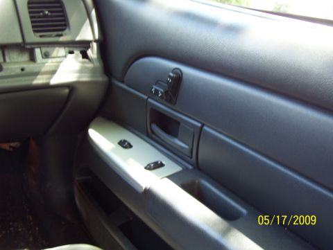 2003 Ford Crown Victoria - Interior view of a car's door panel, showing window controls and an air vent. A date stamp is visible in the lower right corner.