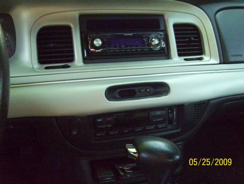 2003 Ford Crown Victoria - The interior dashboard features an aftermarket Kenwood stereo and an automatic shifter, with a date stamp of 05/25/2009.