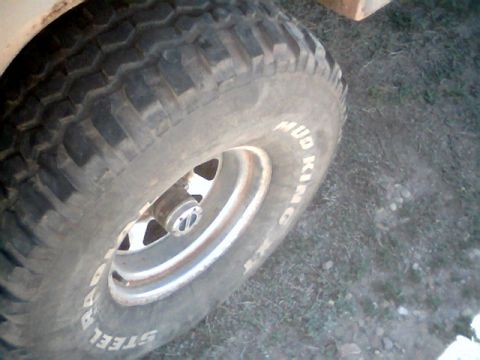 1981 Ford Bronco - Close-up of a tire and wheel, with visible text on the tire's sidewall.