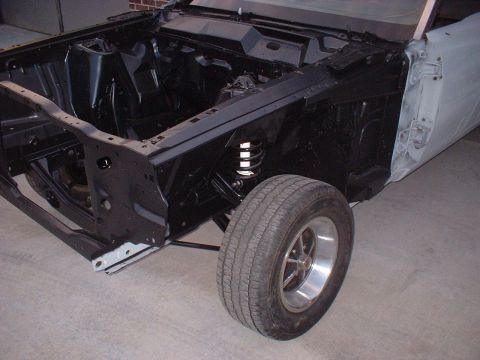 1970 Ford Torino - Front section of a 1970 Ford Torino undergoing restoration, showing the chassis and fender.