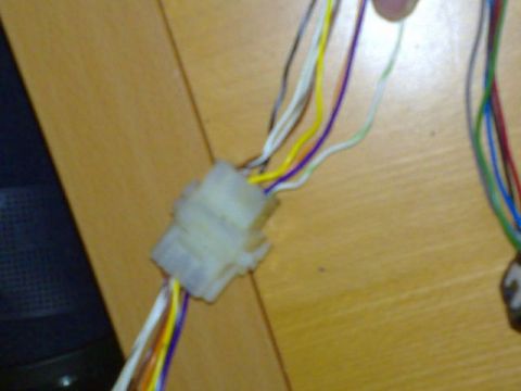 1991 Ford Crown Victoria - A close-up view of a wire harness connector with various colored wires.