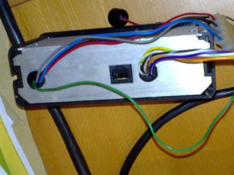 1991 Ford Crown Victoria - This electronic module has numerous wires connected, suggesting it's part of a complex system.