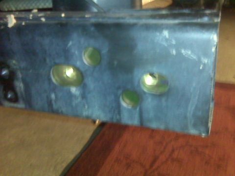 2008 Jeep Wrangler - Close-up of a vehicle bumper part with mounting holes.