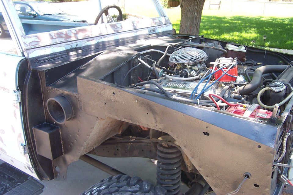 1976 Ford Bronco engine bay with V8 engine and aftermarket air cleaner