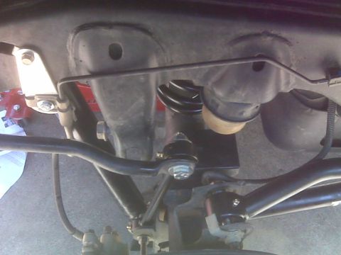 2008 Jeep Wrangler - Close-up of suspension parts, possibly from a Jeep Wrangler, with visible Teraflex branding on the lift components.