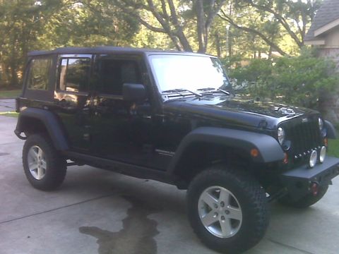 2008 Jeep Wrangler - This black Jeep Wrangler is modified with an aftermarket bumper and auxiliary lights.