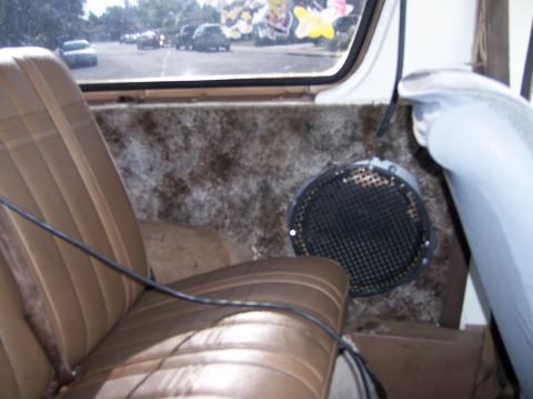 1991 Ford Bronco - View from inside a vehicle, looking out at traffic, with a speaker visible on the side panel.