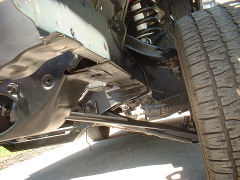 1970 Ford Torino - Undercarriage view showing suspension, steering linkage, and tire.