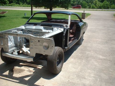 1967 Mercury Cyclone - The 1967 Mercury Cyclone body is shown in a state of disassembly, with its front three-quarter view revealing its stripped-down condition.