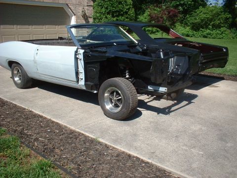 1970 Ford Torino - Project 1970 Ford Torino convertible in primer, with another car behind it.
