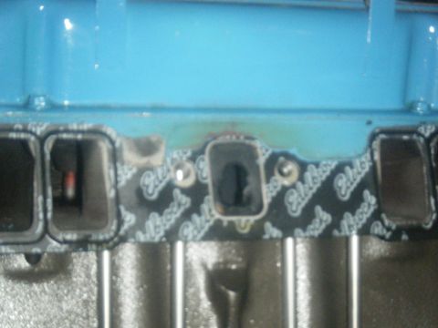 1979 Chevrolet Camaro - Edelbrock gasket on an engine intake manifold, showing port openings.