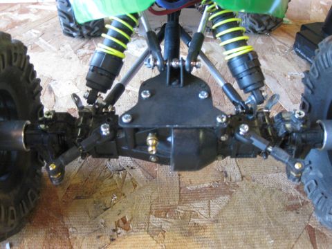 2010 Ford Pickup - Close-up view of the intricate suspension system on a remote-controlled vehicle.