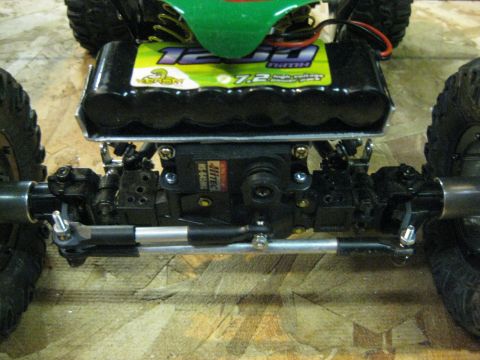 2010 Ford Pickup - Close-up view of the steering and power components of a remote control car.