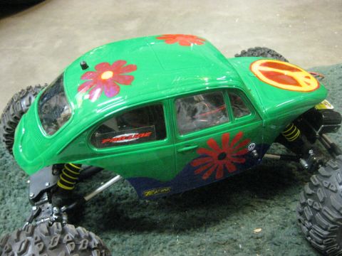 2010 Ford Pickup - This is an RC car body, not a 2010 Ford Pickup. It's painted green with flower decals and a peace sign.