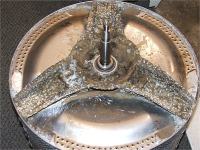 1978 Chevrolet C/K Pickup - This washing machine part shows significant mineral buildup on the agitator and drum.