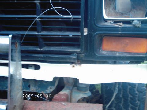 1986 Ford Bronco - Close-up of a 1980s Ford Bronco's front end, revealing its grille and bumper details.