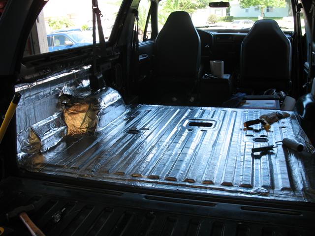 Bronco rear cargo floor covered in reflective silver sound-deadening insulation