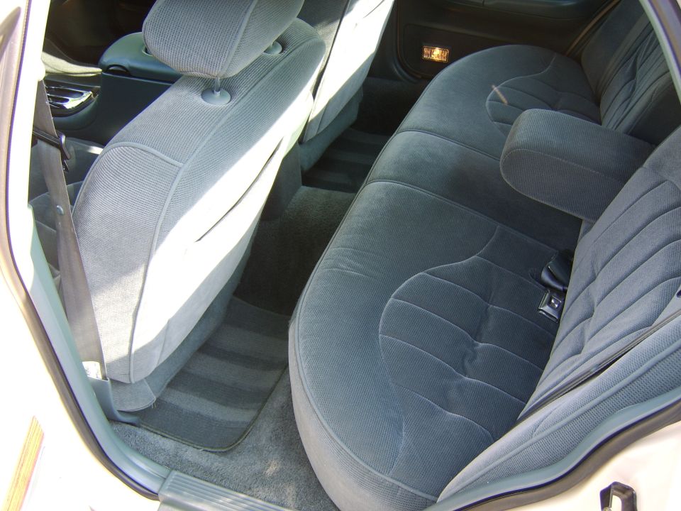 Dark blue cloth rear bench seat interior of a sedan