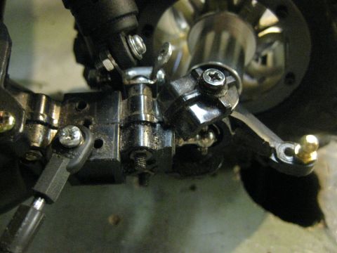 2010 Ford Pickup - Detail of a vehicle's suspension system, showing mechanical linkages and fasteners.