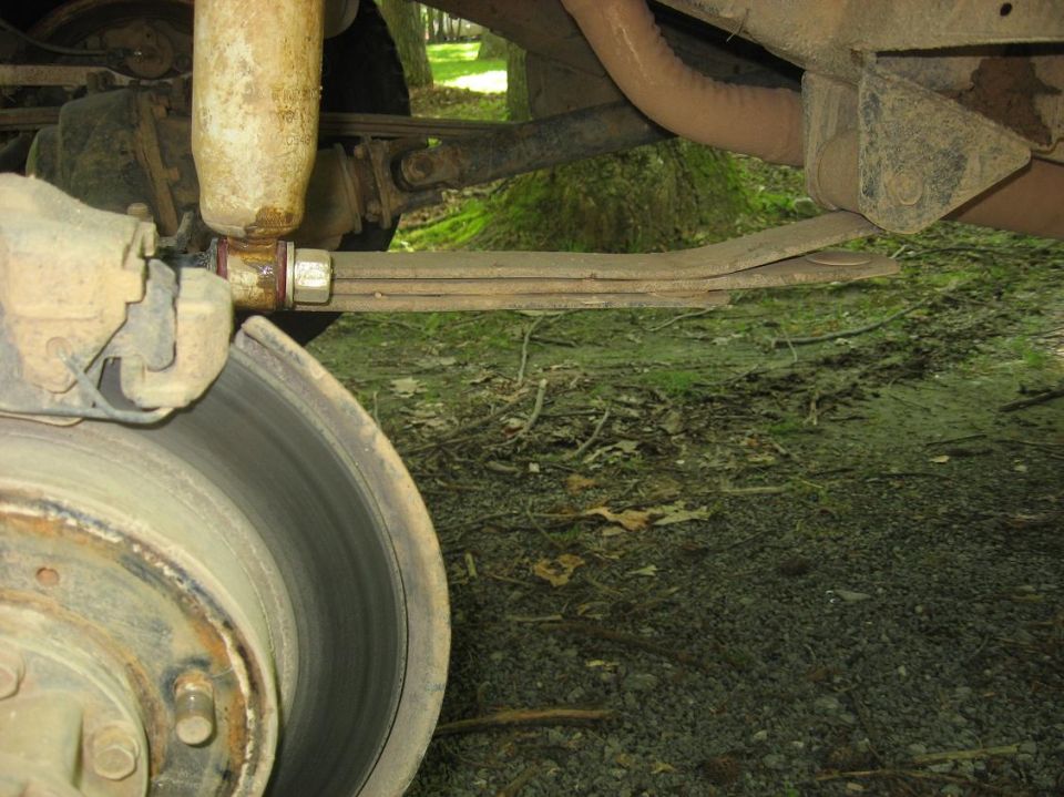 1987 Suzuki Samurai rear leaf spring suspension, shock absorber, and brake rotor
